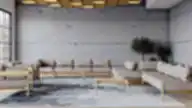 Skandinaviško stiliaus poilsio zona su modulinėmis smėlio spalvos sofomis, mediniais rėmais, betonine siena ir abstrakčiu kilimu