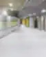 Gabijos progimnazijos koridorius su pilkomis spintelėmis geltonais užrašais.
