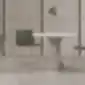 Žalios Aryn Max kėdės prie balto apvalaus stalo minimalistiniame interjere
