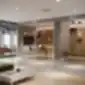 Dvi žalios Chic 20 CH baro kėdės moderniame biure